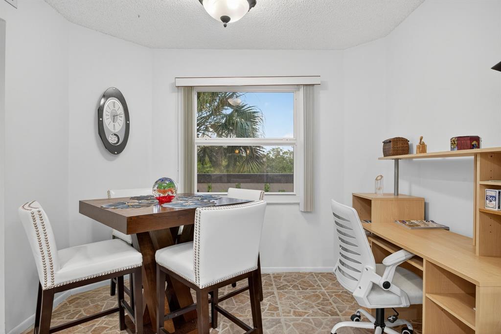 1801 Eleuthera Point, Unit D3 Coconut Creek, FL 33066 - Photo 6 of 80 a view of a dining room with furniture window and outside view