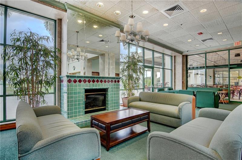 1801 Eleuthera Point, Unit D3 Coconut Creek, FL 33066 - Photo 73 of 80 a living room with furniture and a fireplace