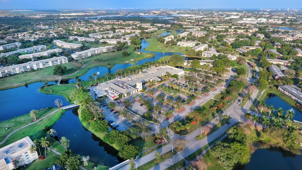1801 Eleuthera Point, Unit D3 Coconut Creek, FL 33066 - Photo 77 of 80 an aerial view of residential houses with outdoor space and street view
