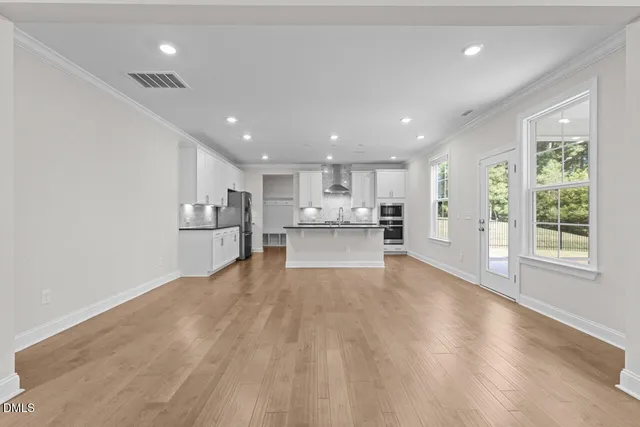 a view of kitchen with wooden floor