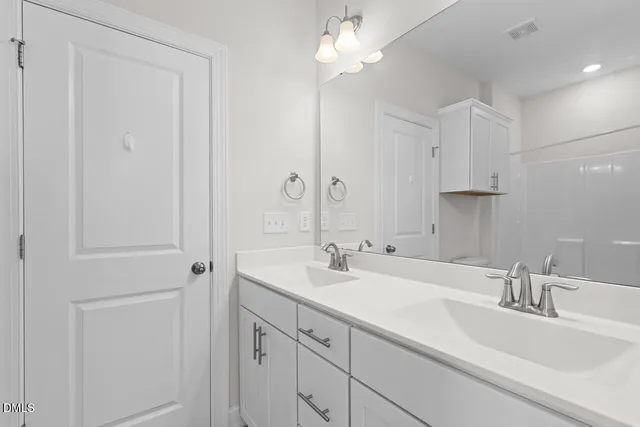 a bathroom with a toilet and a bathtub