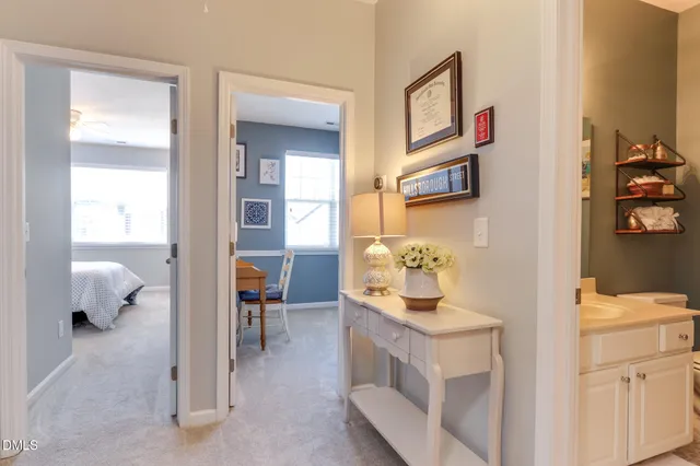 a room with gym equipment and lots of wooden furniture