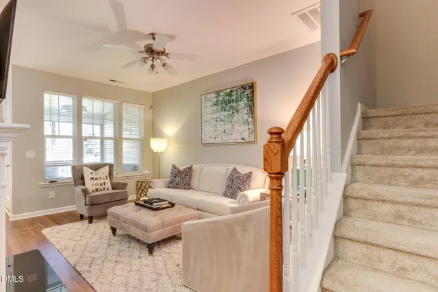 a kitchen with granite countertop white cabinets and a stove top oven
