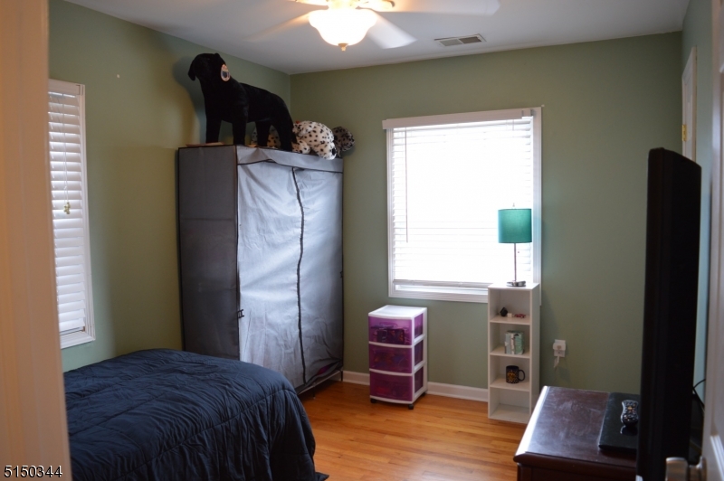 119 Green Pond Road Rockaway, NJ 07866 - Photo 11 of 14 a bedroom with a bed and a window