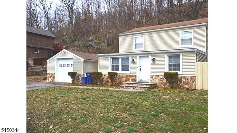 119 Green Pond Road Rockaway, NJ 07866 - Photo 2 of 14 a view of a house with a yard and sitting area