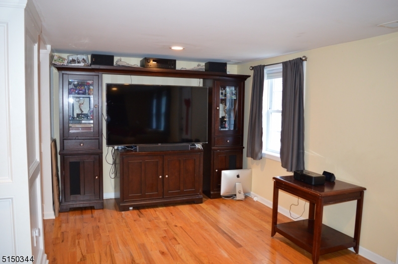 119 Green Pond Road Rockaway, NJ 07866 - Photo 6 of 14 a bedroom with a bed and a mirror