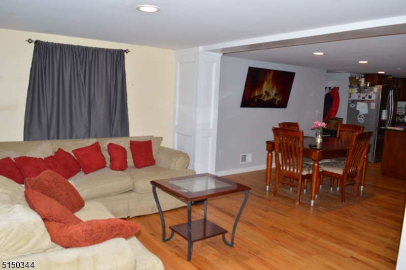 119 Green Pond Road Rockaway, NJ 07866 - Photo 8 of 14 a living room with furniture and a flat screen tv