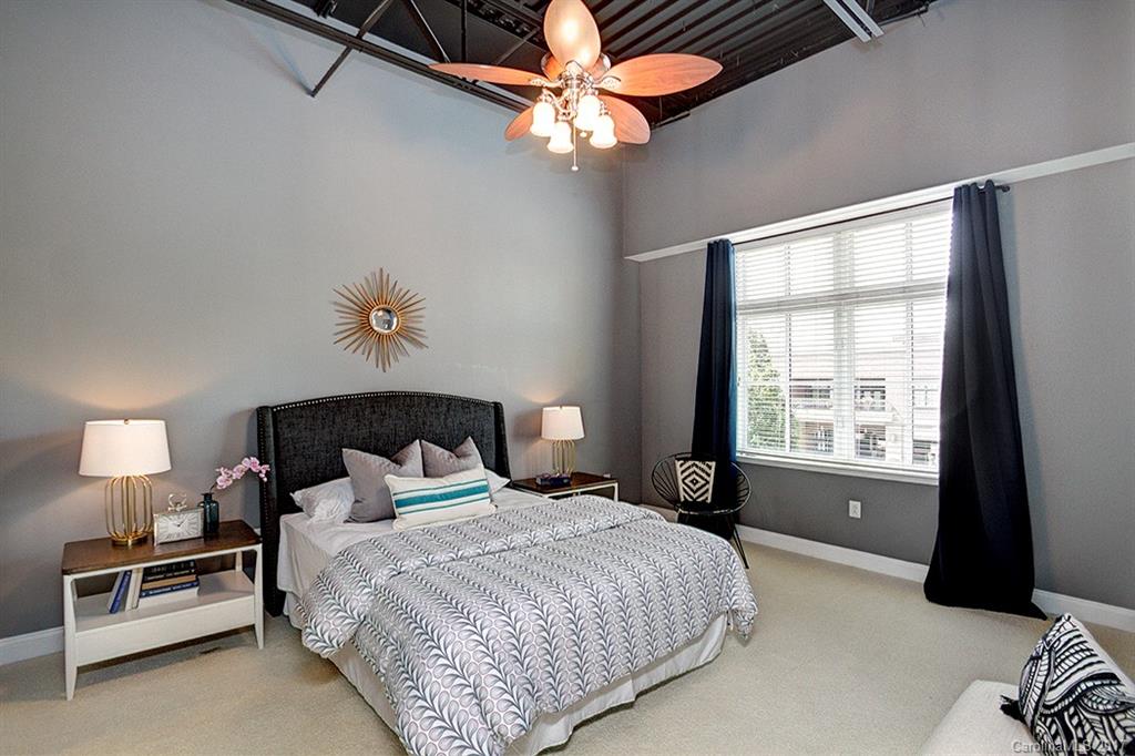 3920 Sharon Road, Unit 206 Charlotte, NC 28211 - Photo 13 of 24 a bedroom with a bed and a window