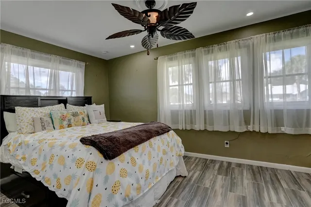 a bedroom with a bed and window