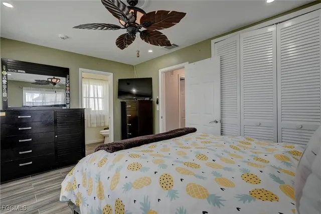 a bedroom with a bed and a dresser