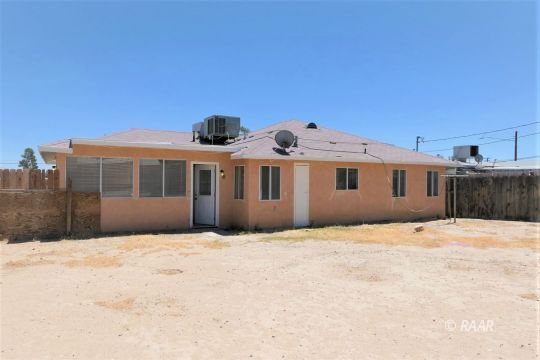 229 North Helena Street Ridgecrest, CA 93555 - Photo 32 of 32 a front view of a house with a yard