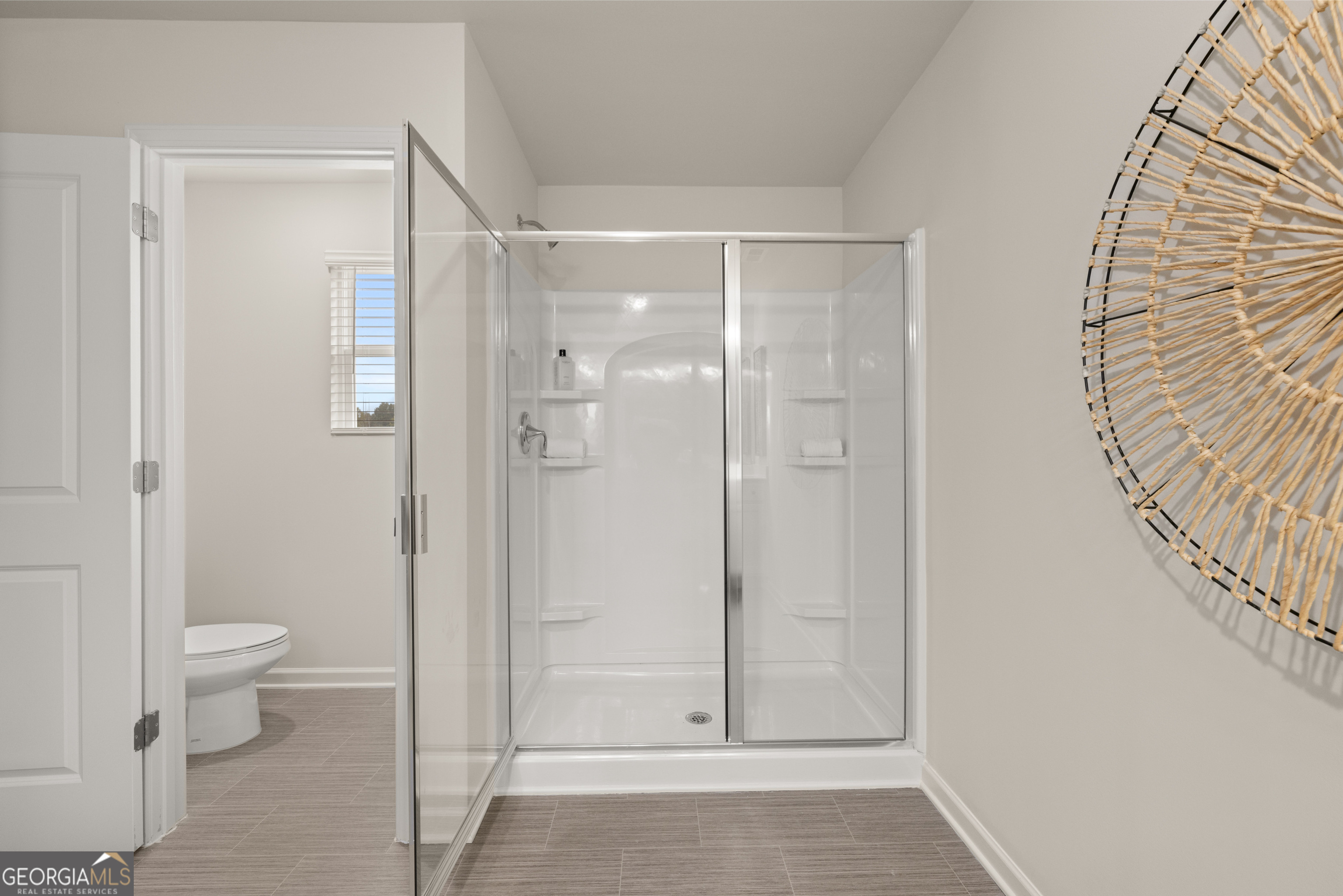 1042 Merritt Drive, Unit 22 Villa Rica, GA 30180 - Photo 13 of 24 a bathroom with a shower and a toilet