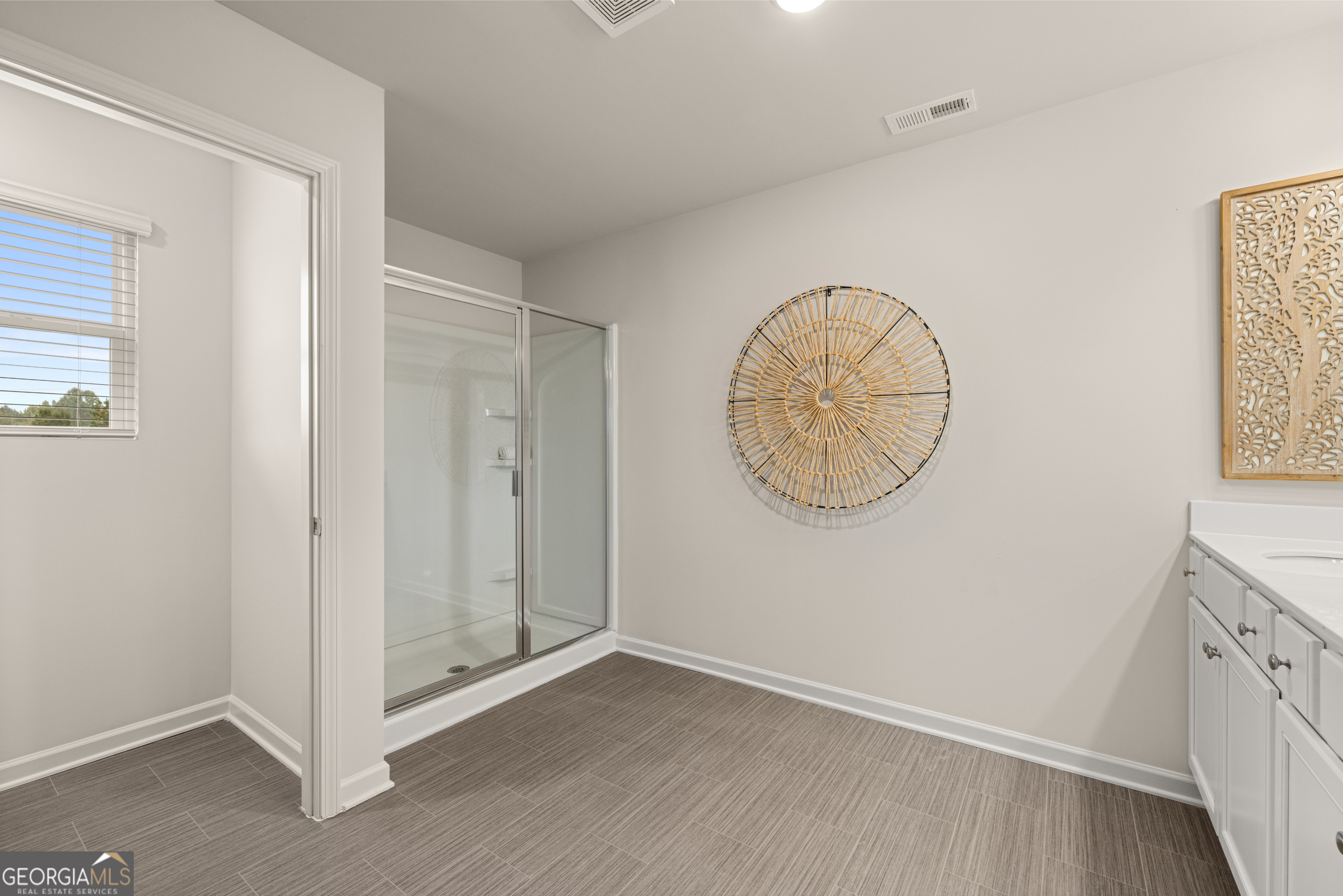 1042 Merritt Drive, Unit 22 Villa Rica, GA 30180 - Photo 15 of 24 an empty room with wooden floor and windows