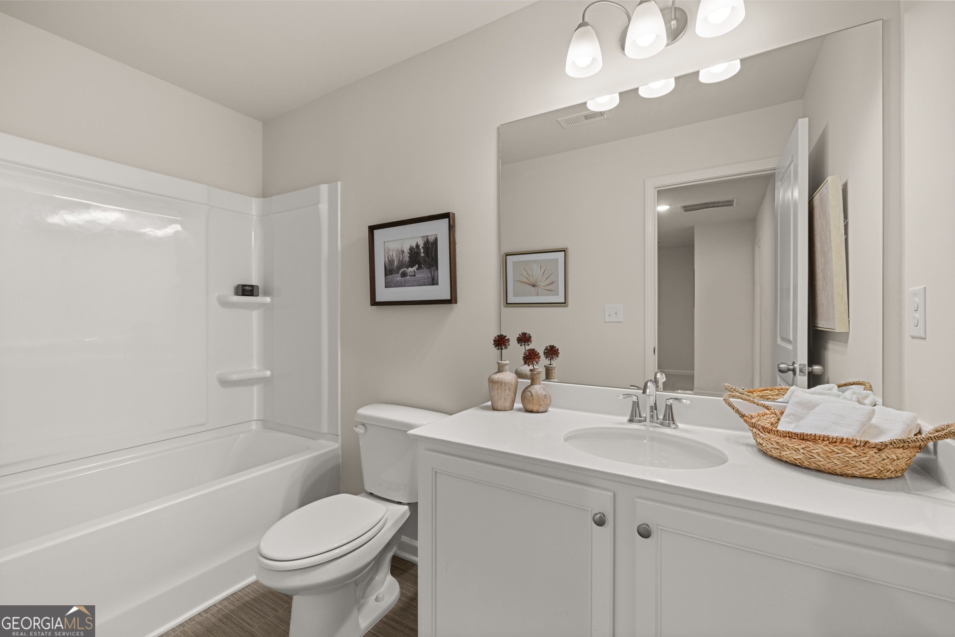 1042 Merritt Drive, Unit 22 Villa Rica, GA 30180 - Photo 18 of 24 a bathroom with a sink toilet tub and shower
