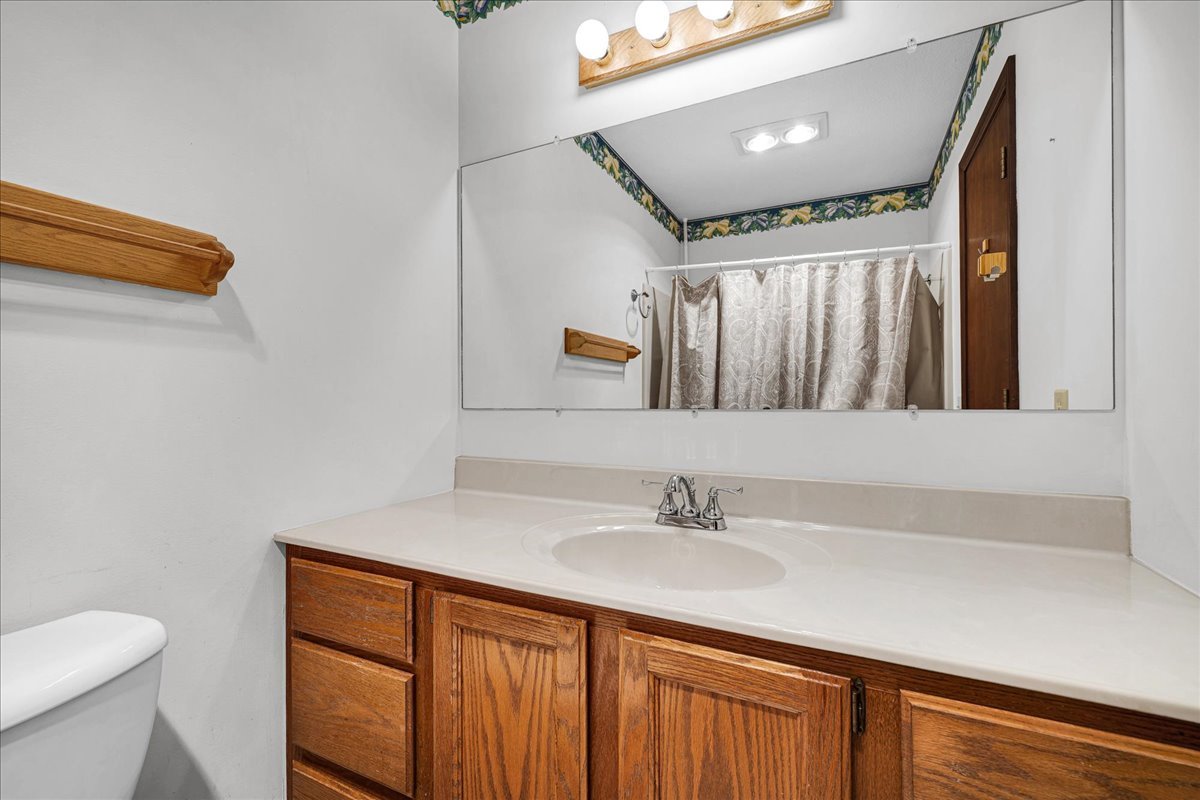1509 Fort Jesse Road, Unit 13 Normal, IL 61761 - Photo 16 of 30 a bathroom with a sink a toilet and a mirror
