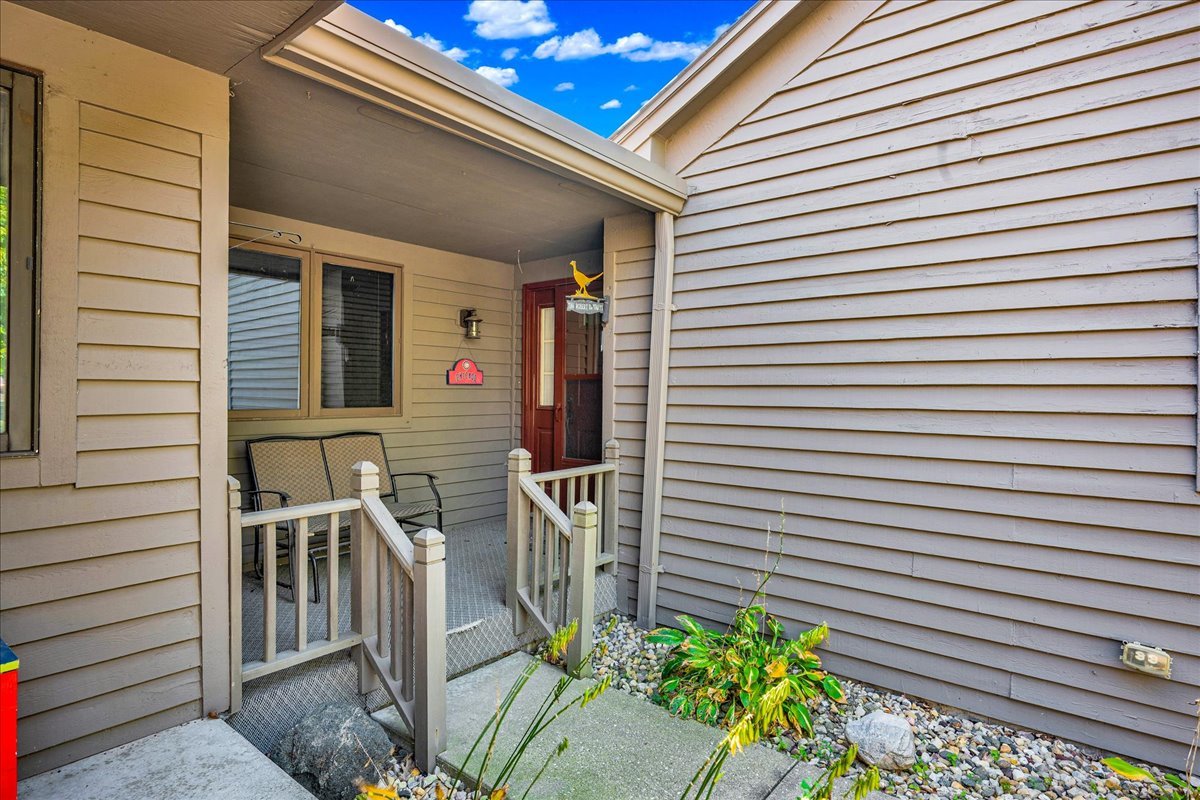 1509 Fort Jesse Road, Unit 13 Normal, IL 61761 - Photo 2 of 30 a view of a house with a large window and potted plants