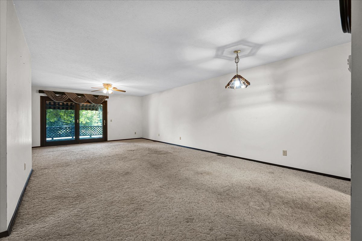 1509 Fort Jesse Road, Unit 13 Normal, IL 61761 - Photo 4 of 30 an empty room with a empty space and windows