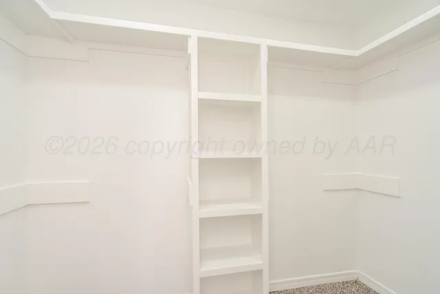 a view of an empty walk in closet