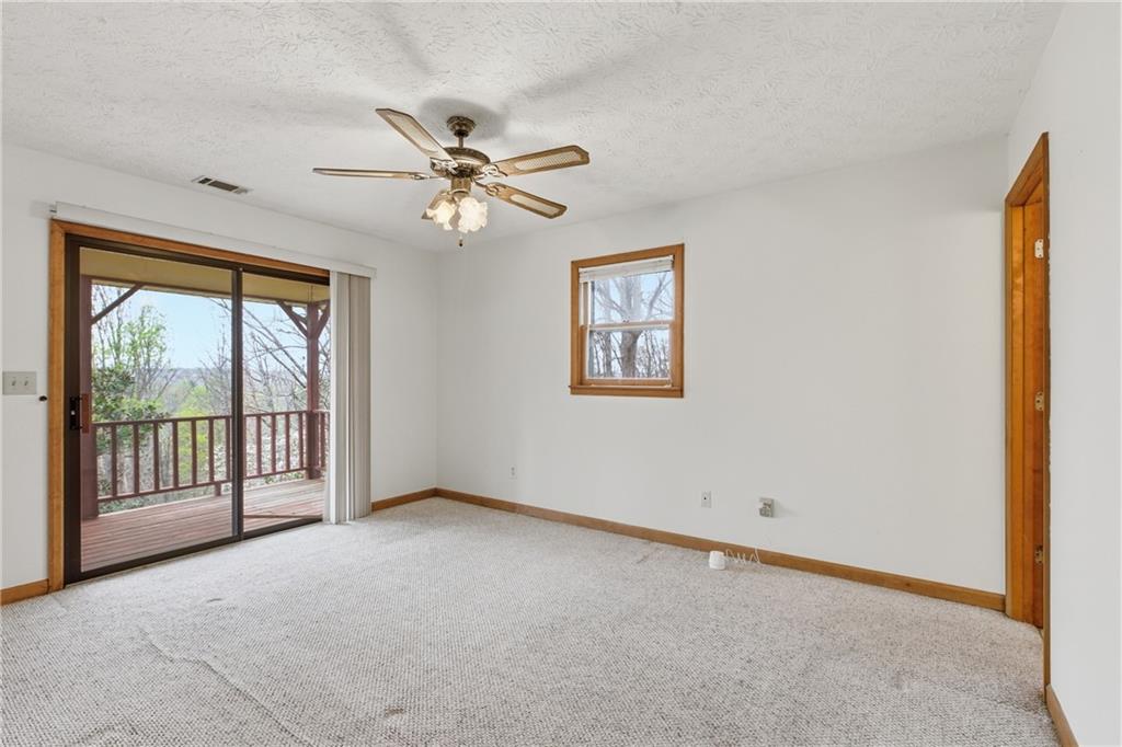 143 Copperhead Road Cornelia, GA 30531 - Photo 13 of 56 a view of an empty room with a window