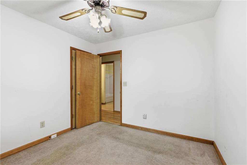 143 Copperhead Road Cornelia, GA 30531 - Photo 19 of 56 an empty room with a chandelier fan