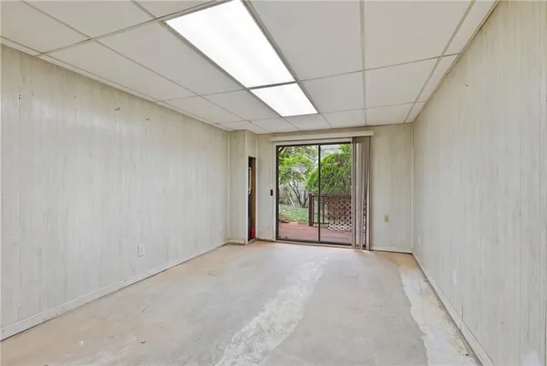 a view of an empty room with a sliding door