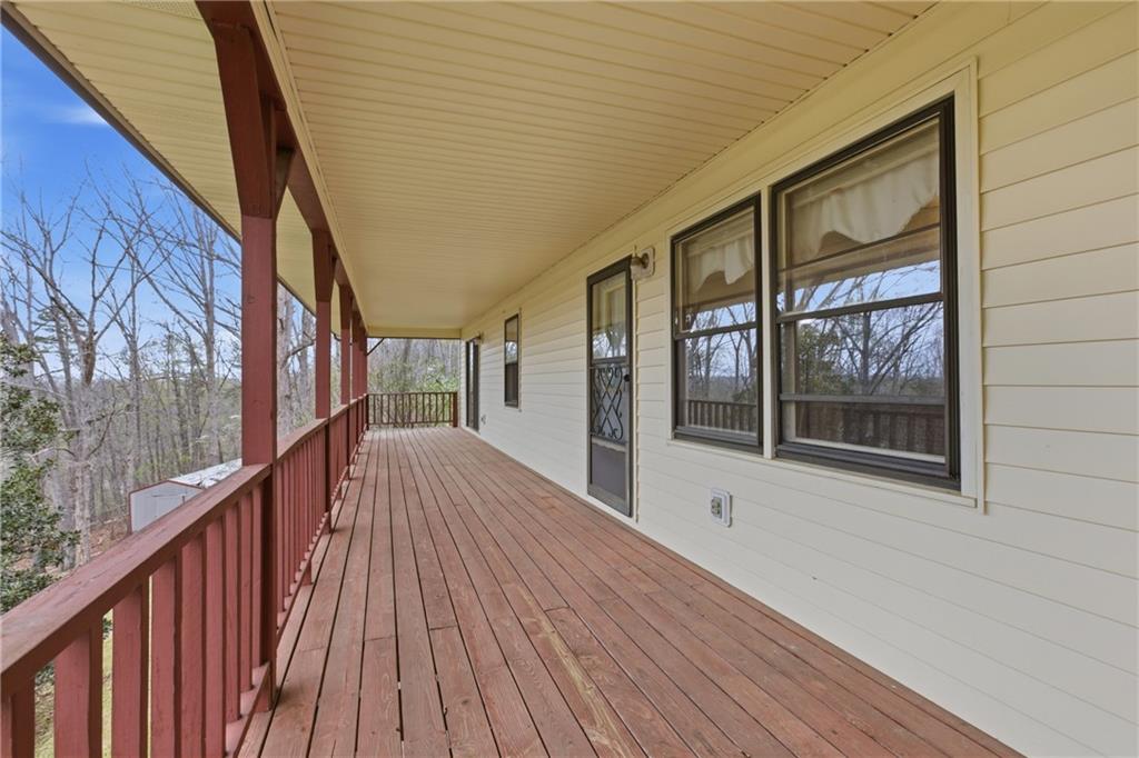 143 Copperhead Road Cornelia, GA 30531 - Photo 3 of 56 a view of balcony with wooden floor and fence