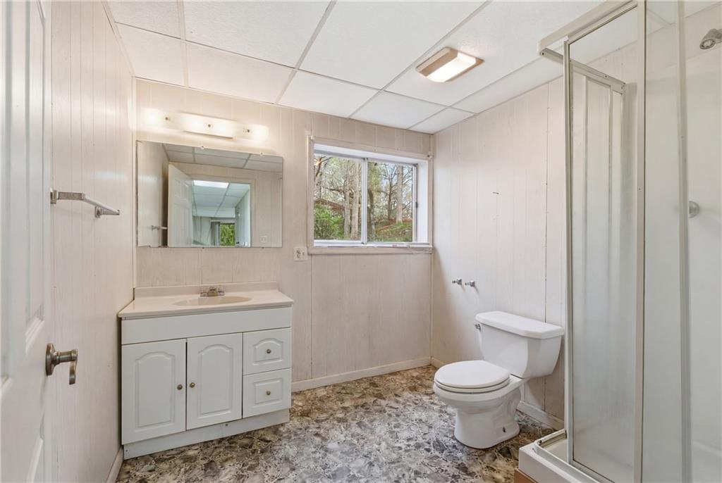 143 Copperhead Road Cornelia, GA 30531 - Photo 38 of 56 a bathroom with a toilet a sink and a window