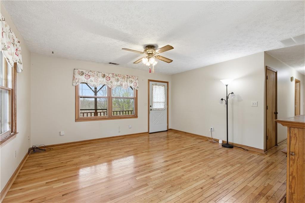143 Copperhead Road Cornelia, GA 30531 - Photo 5 of 56 wooden floor in an empty room with a window