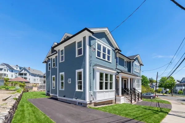 a front view of a house with a yard