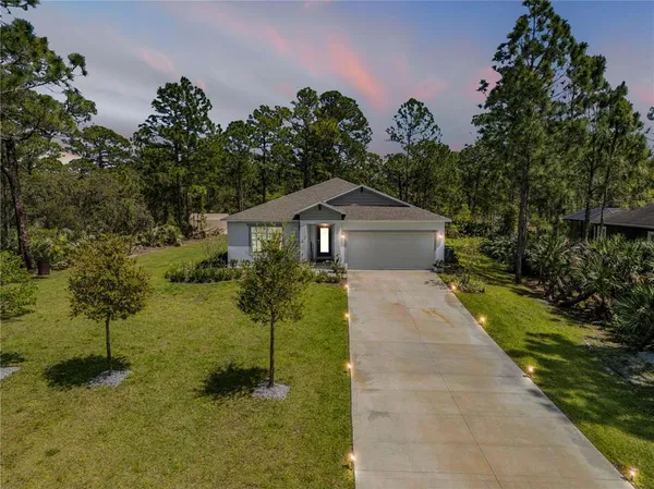a house view with a garden space
