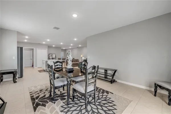 a bedroom with a bed and a night stand