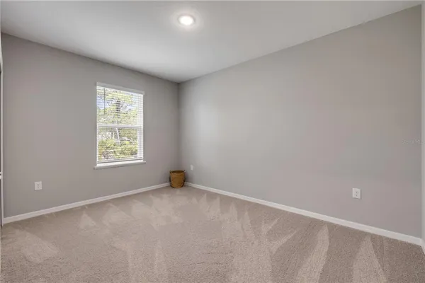 a bedroom with two beds and a couch