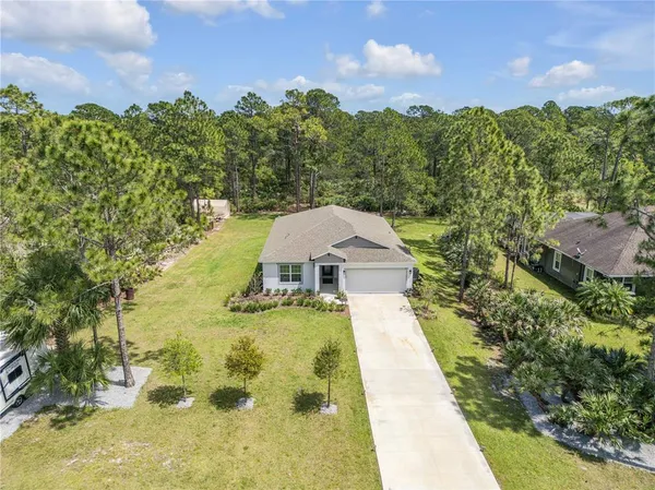 a view of a yard with swimming pool