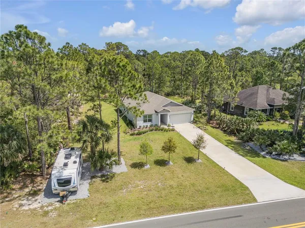a view of a swimming pool with a yard