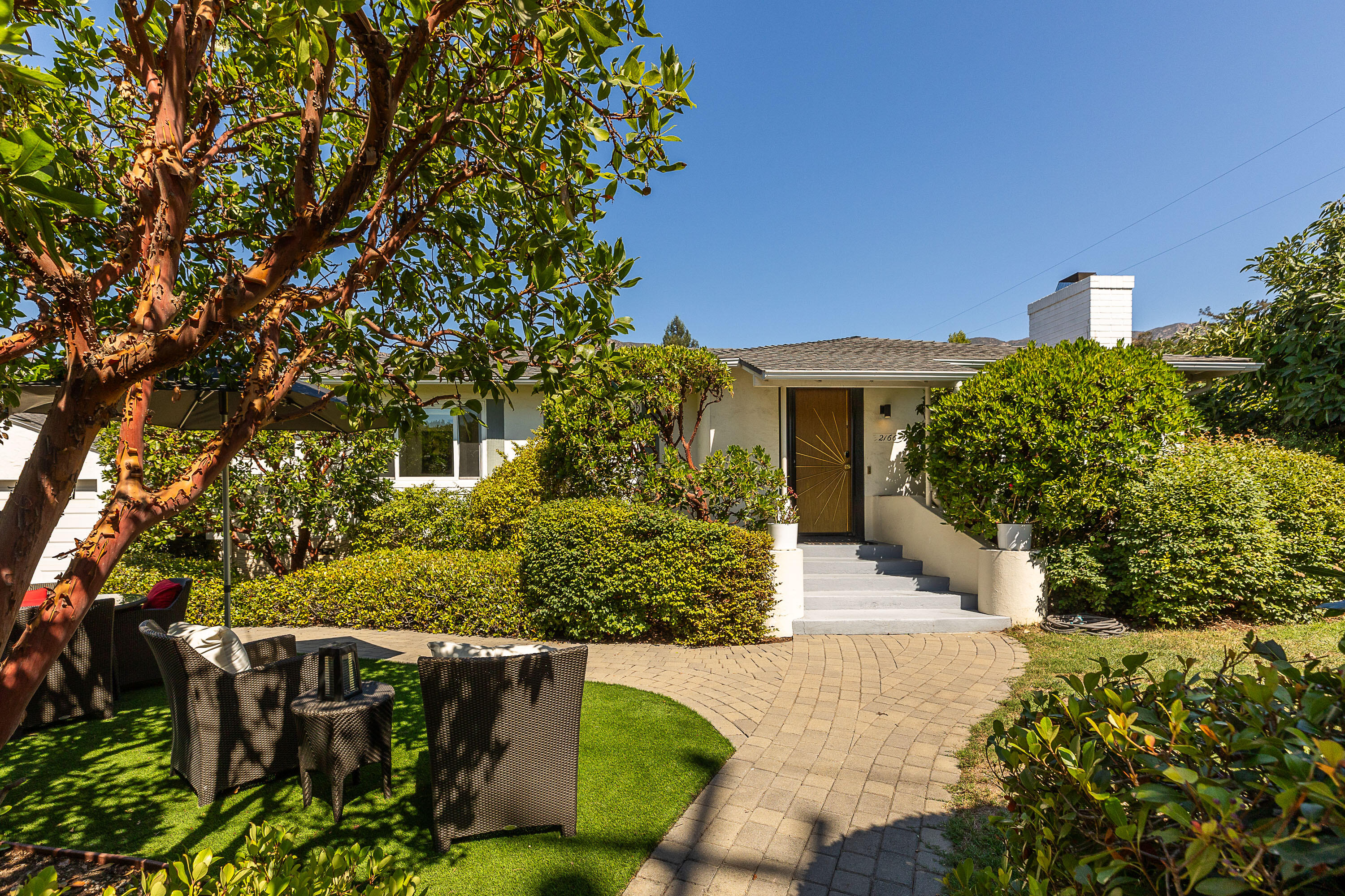 a front view of a house with a yard