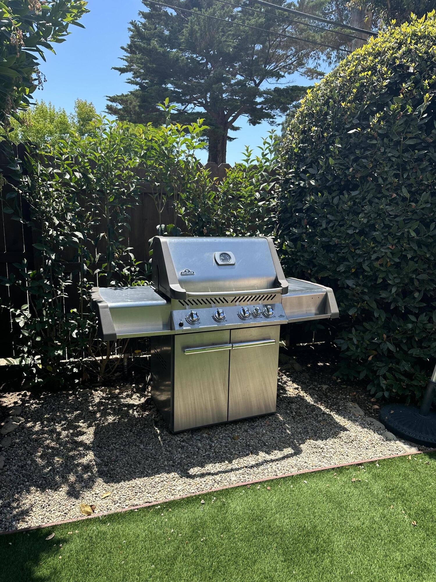 2166 East Valley Road Montecito, CA 93108 - Photo 19 of 30 a view of a backyard with a chairs and a small yard