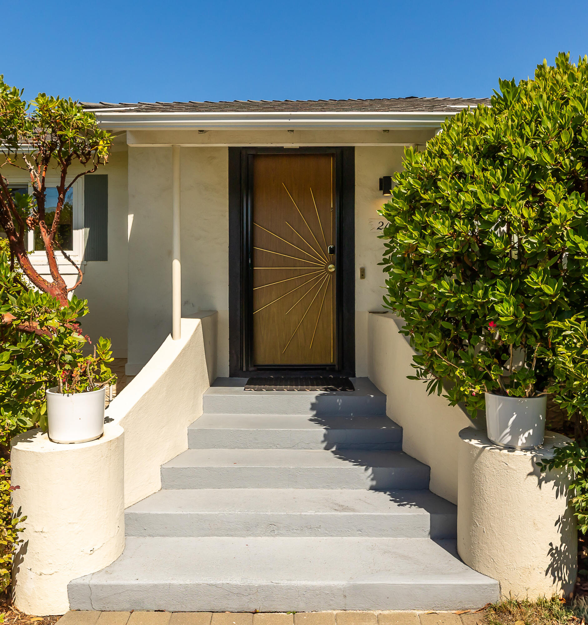2166 East Valley Road Montecito, CA 93108 - Photo 21 of 30 a view of a house with a potted plant