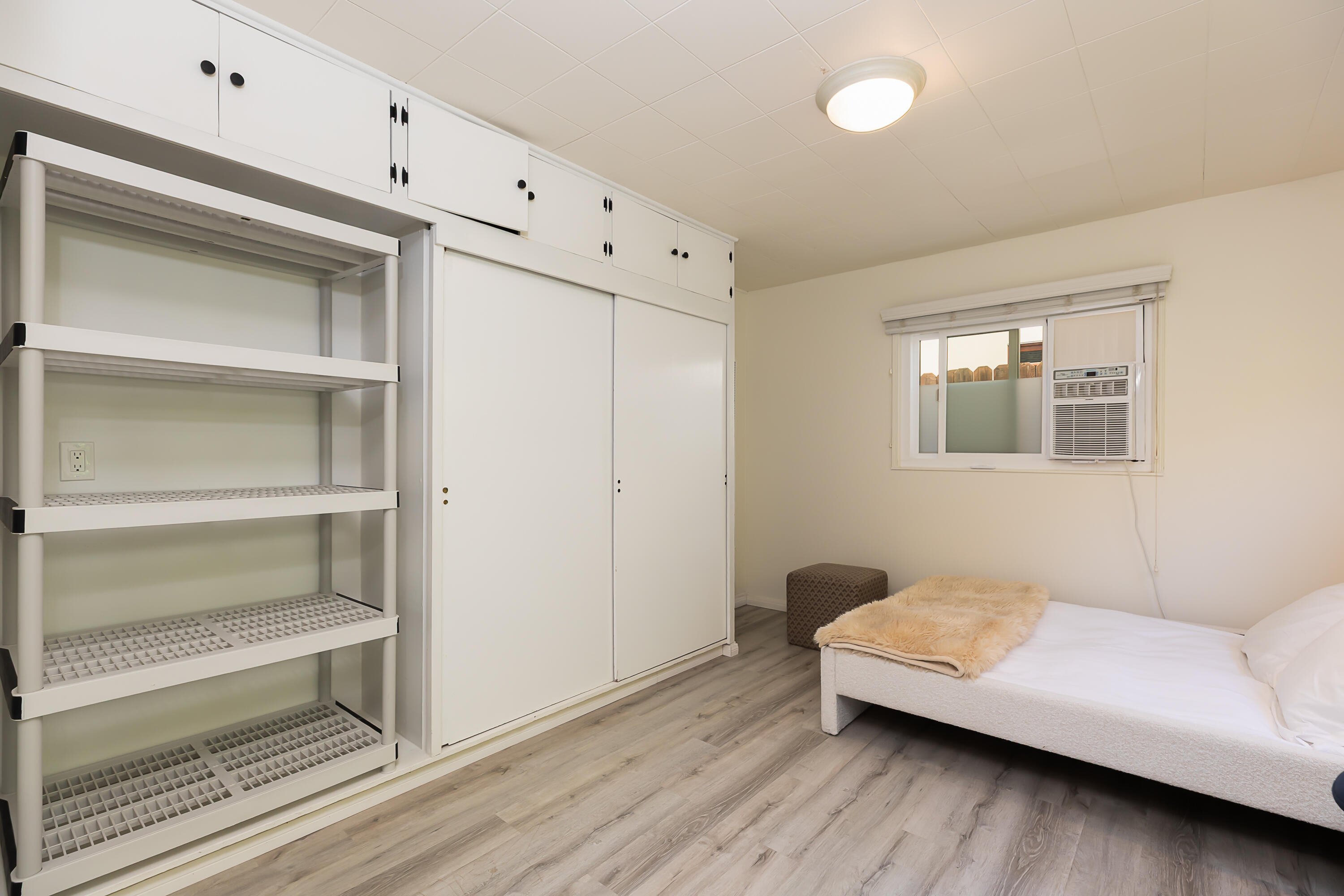 2166 East Valley Road Montecito, CA 93108 - Photo 25 of 30 a bedroom with a bed and a couch