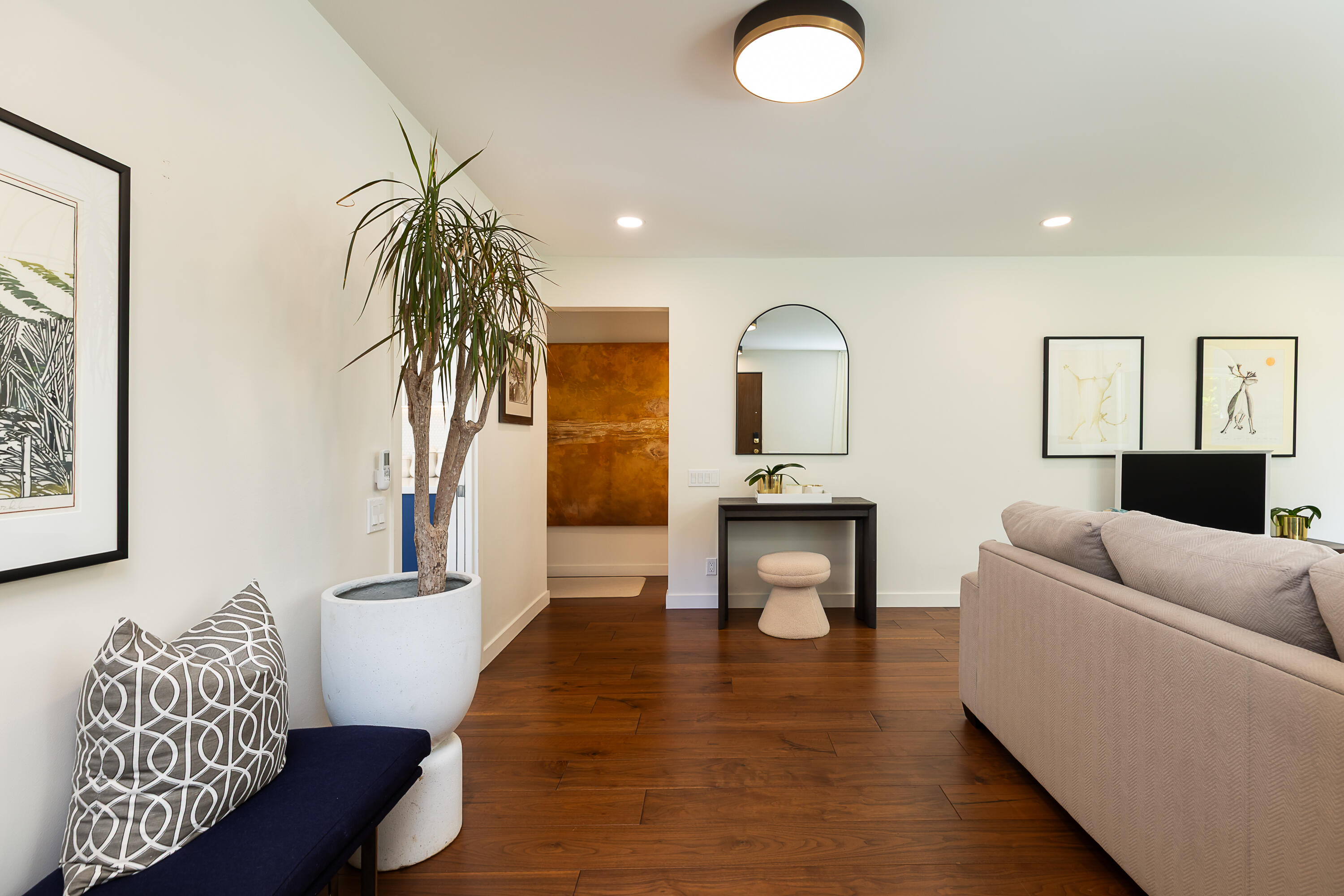 2166 East Valley Road Montecito, CA 93108 - Photo 5 of 30 a living room with furniture and a potted plant