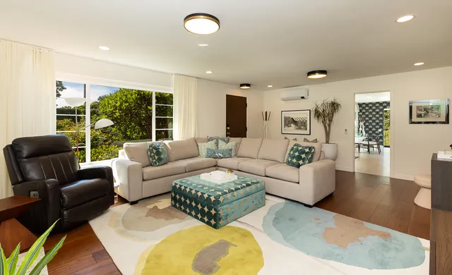 a bedroom with a large bed and a window