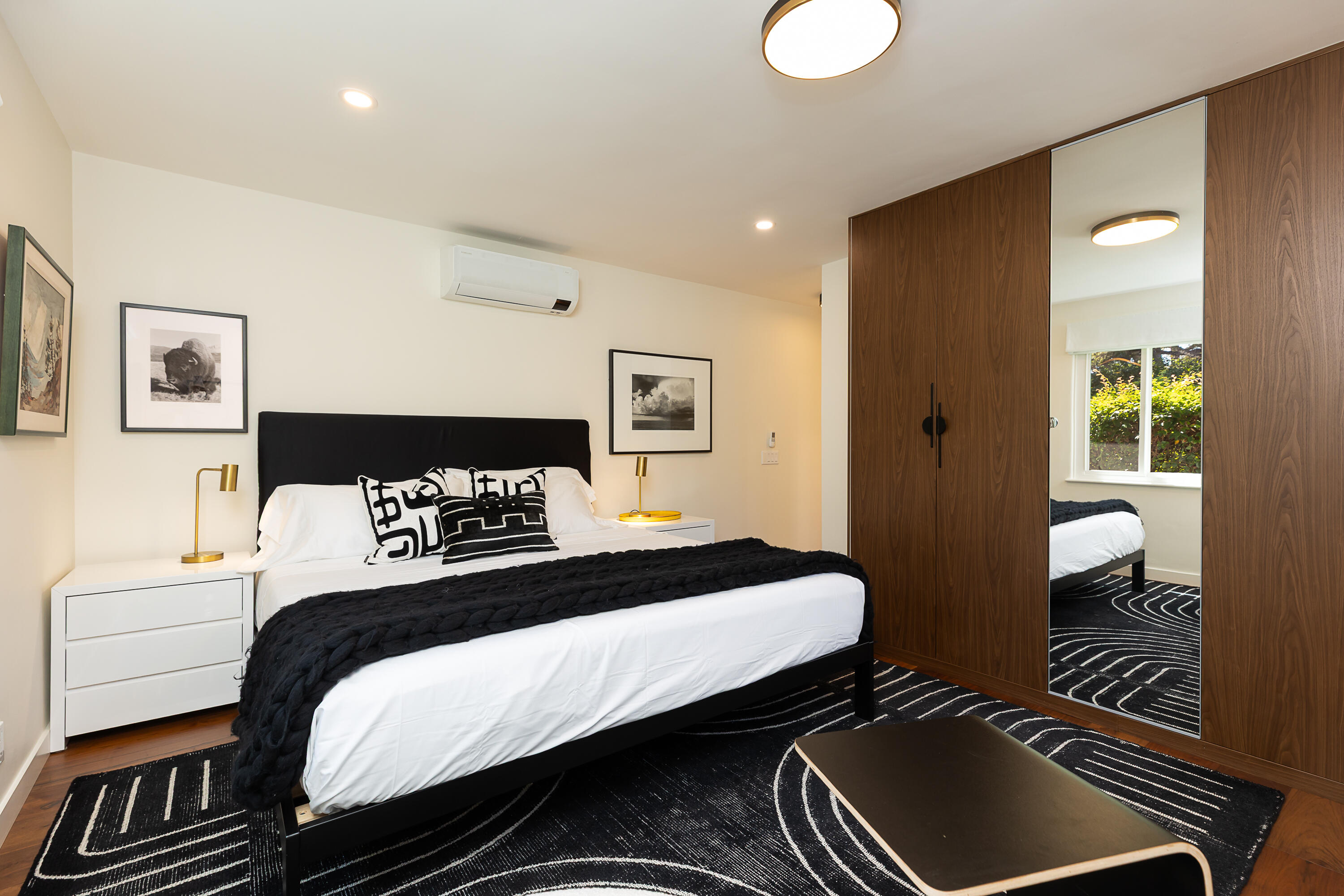 2166 East Valley Road Montecito, CA 93108 - Photo 10 of 30 a bedroom with a bed and wooden floor