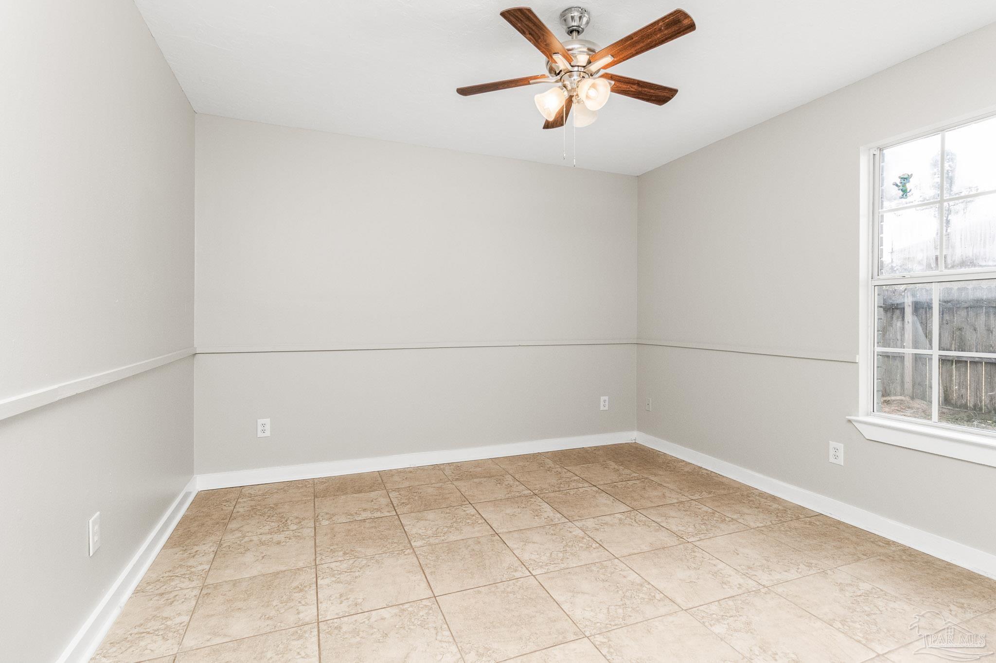 1655 Eagle Terrace Cantonment, FL 32533 - Photo 11 of 47 an empty room with windows and fan