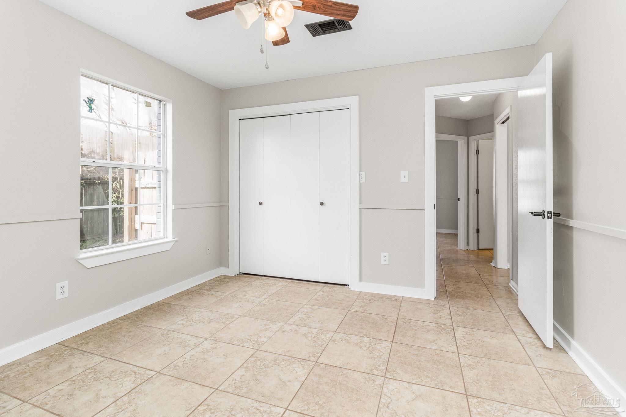 1655 Eagle Terrace Cantonment, FL 32533 - Photo 12 of 47 a view of an empty room with a window