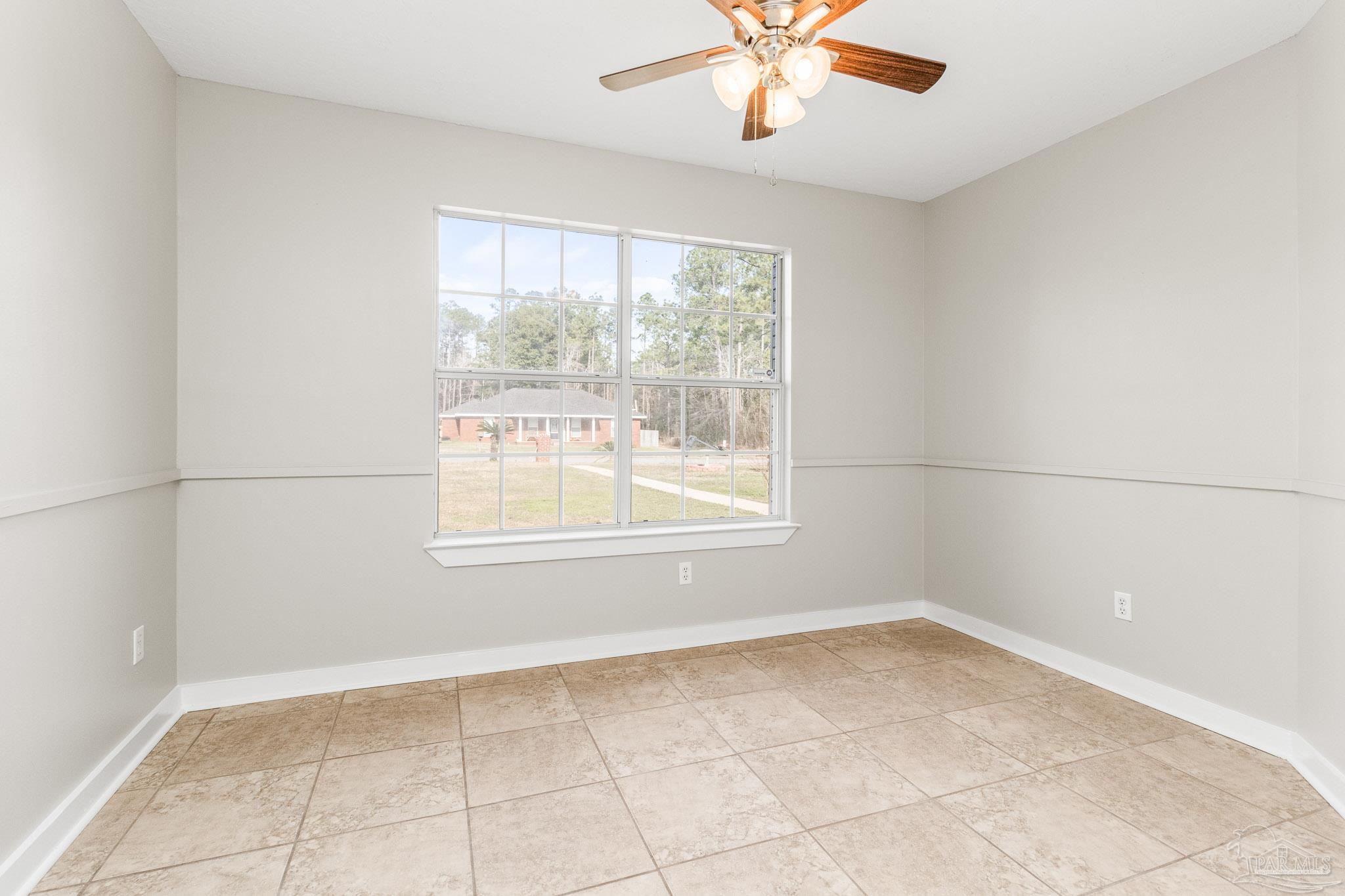 1655 Eagle Terrace Cantonment, FL 32533 - Photo 16 of 47 a view of an empty room with a window