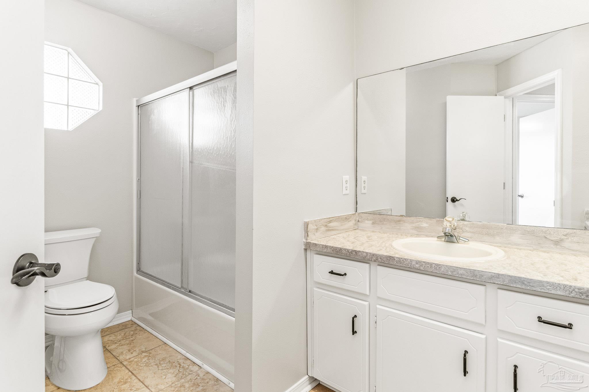 1655 Eagle Terrace Cantonment, FL 32533 - Photo 18 of 47 a bathroom with a granite countertop sink toilet and shower
