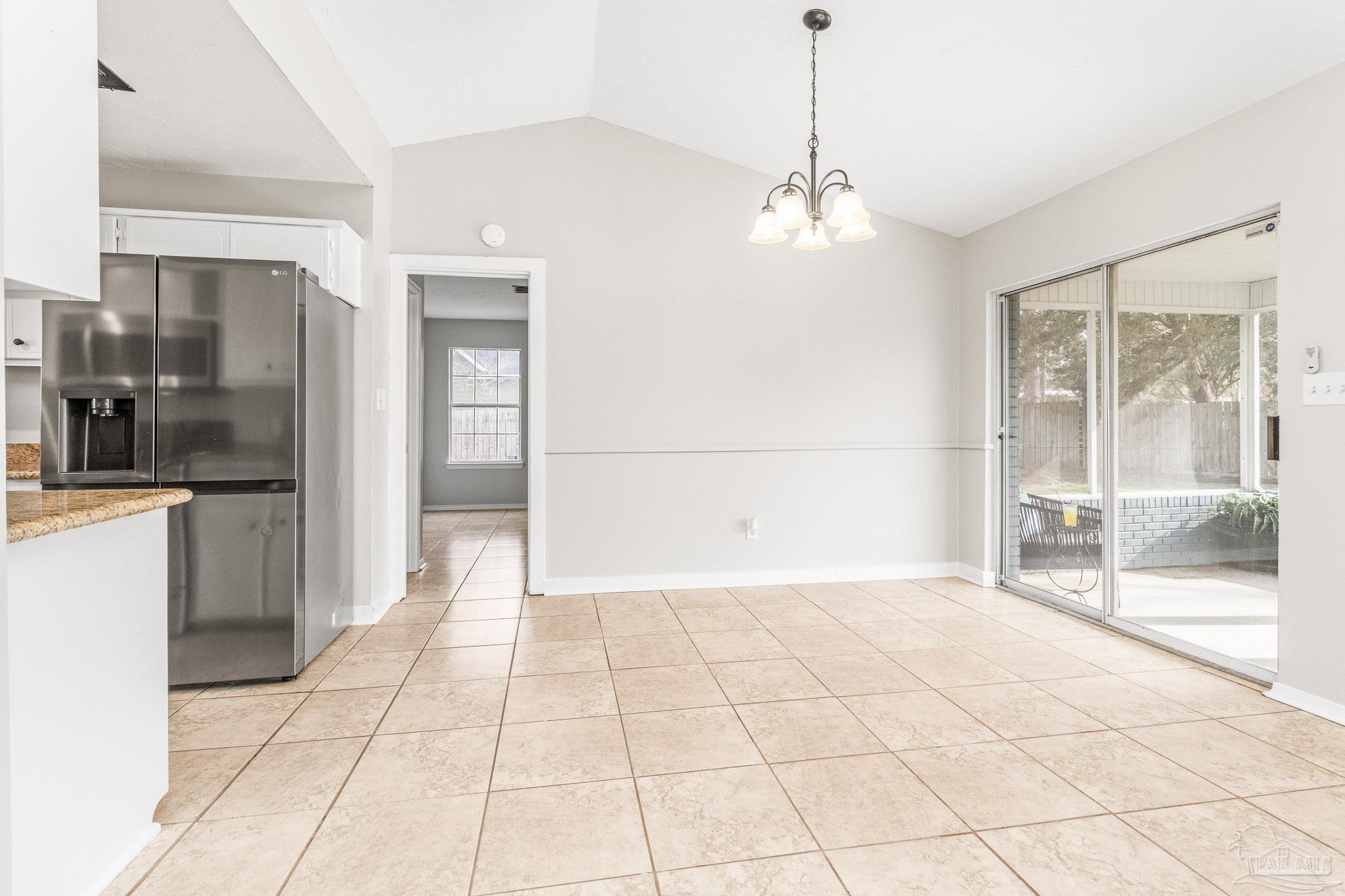 1655 Eagle Terrace Cantonment, FL 32533 - Photo 22 of 47 a view of a kitchen with a sink and a refrigerator