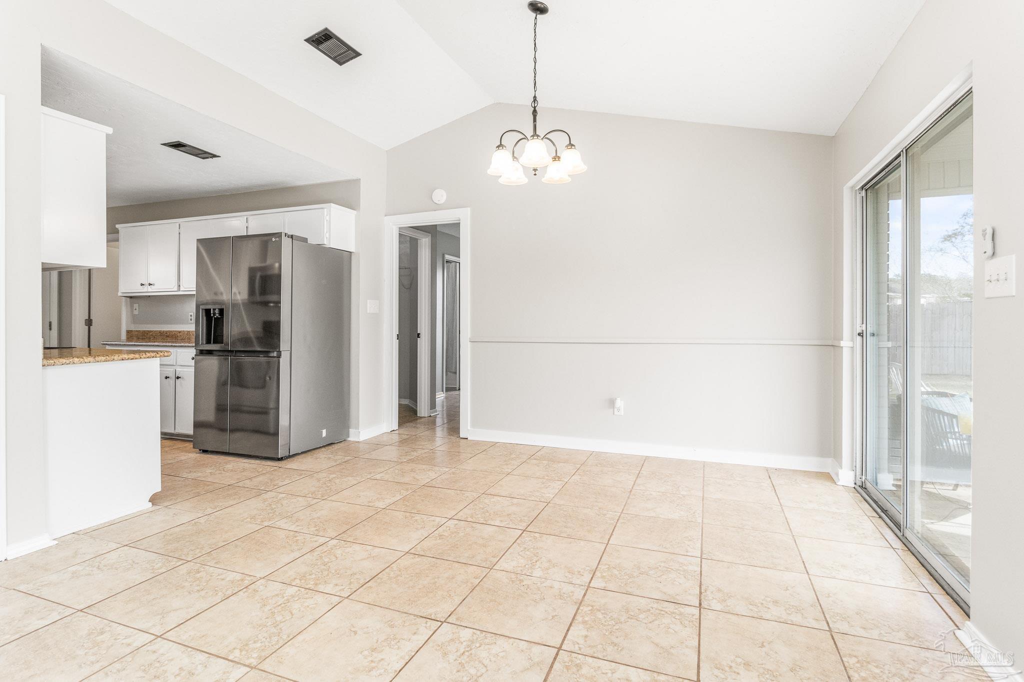 1655 Eagle Terrace Cantonment, FL 32533 - Photo 23 of 47 a view of a kitchen with refrigerator and an oven