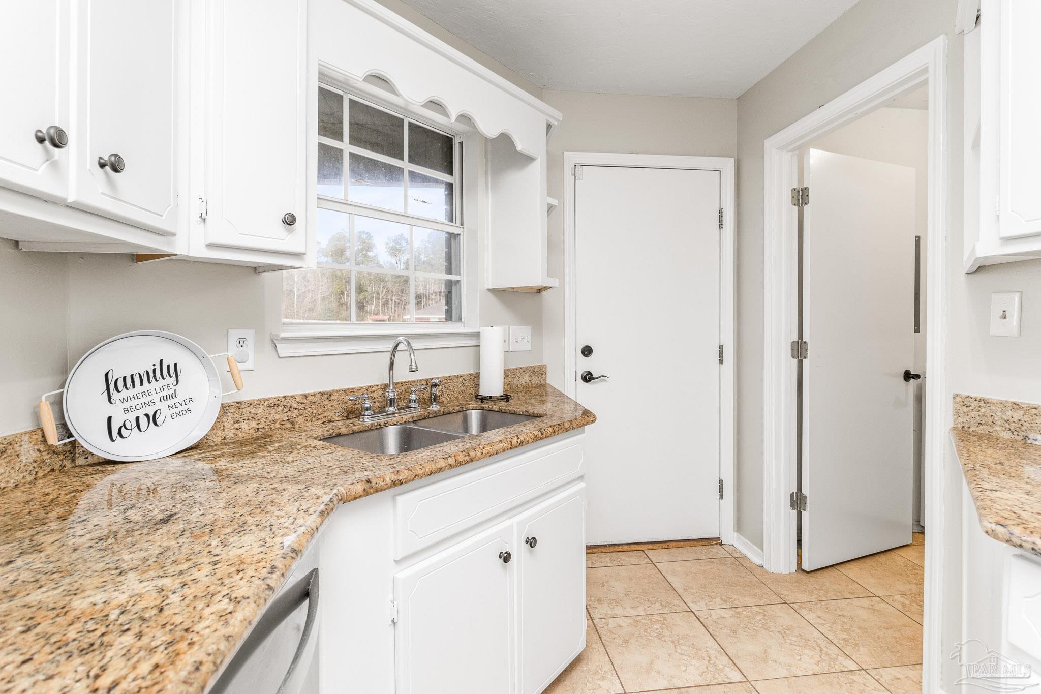 1655 Eagle Terrace Cantonment, FL 32533 - Photo 28 of 47 a bathroom with a granite countertop sink and a shower
