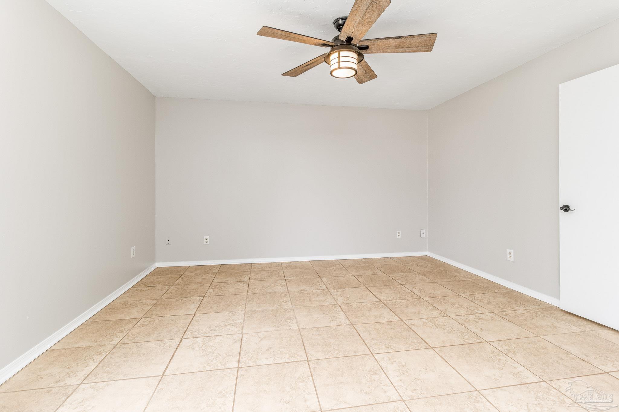 1655 Eagle Terrace Cantonment, FL 32533 - Photo 31 of 47 an empty room with white walls and ceiling fan
