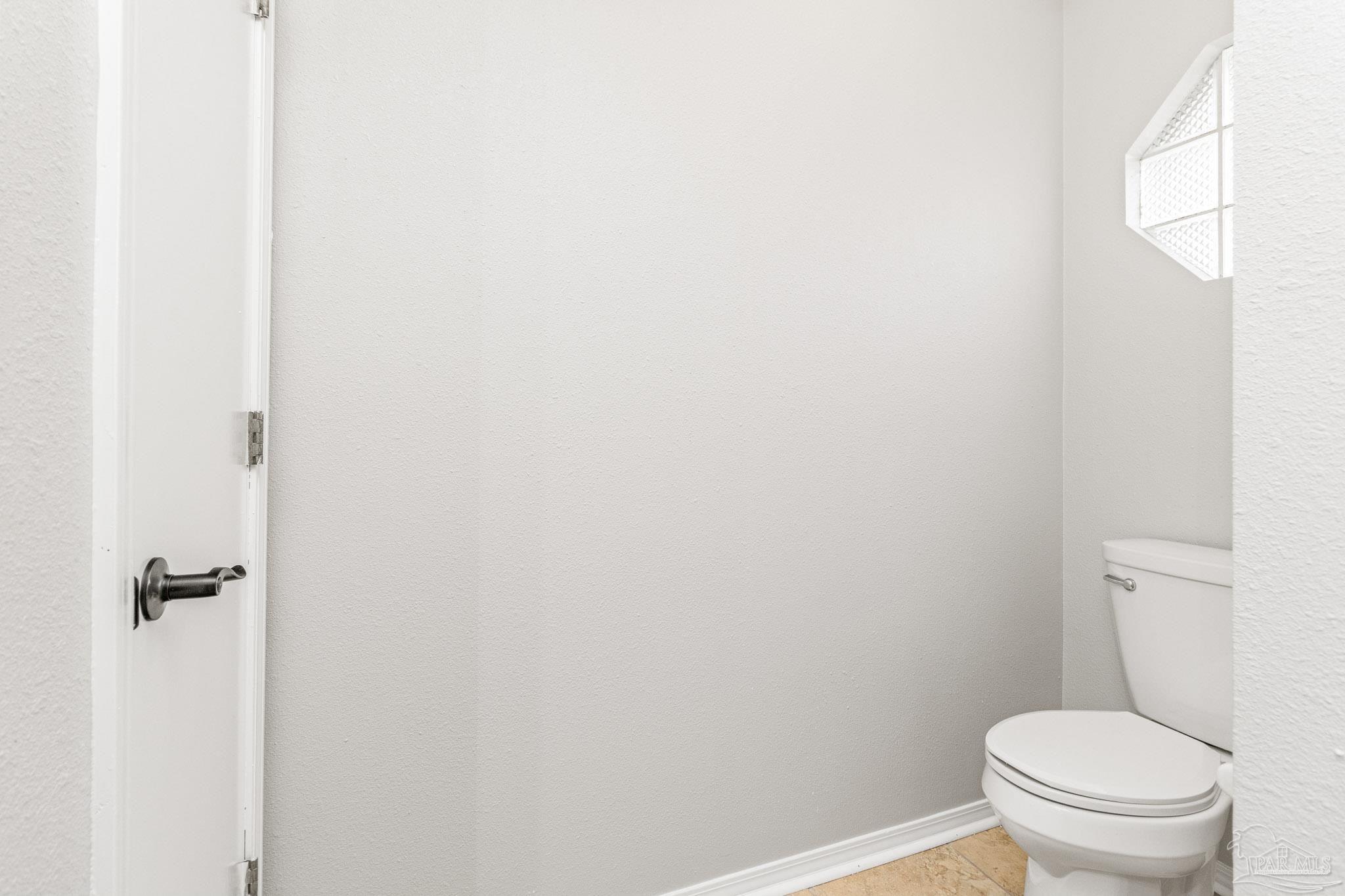 1655 Eagle Terrace Cantonment, FL 32533 - Photo 35 of 47 a white toilet sitting next to a shower